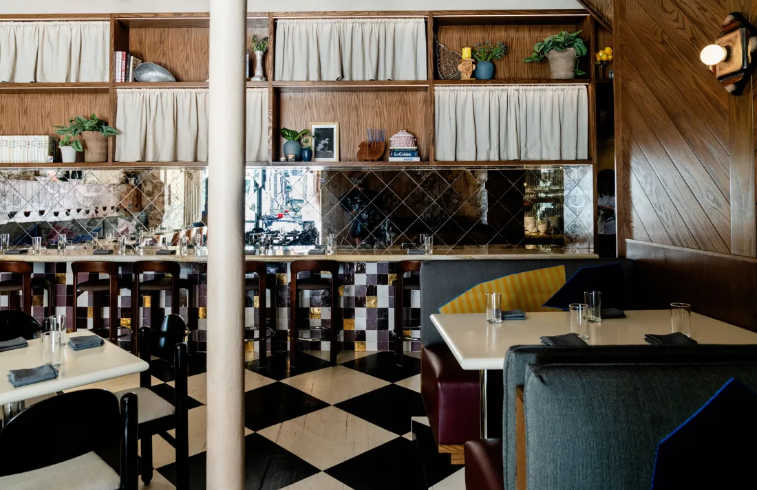 The bar at Creepies, with a tiled back wall.