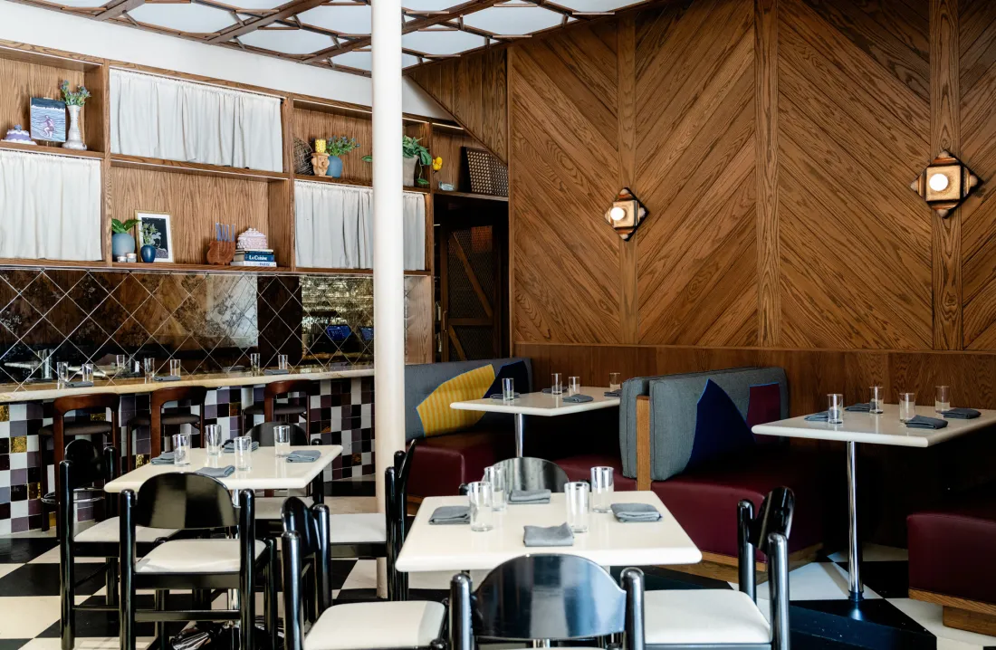 A wood-paneled corner of banquettes at Creepies.