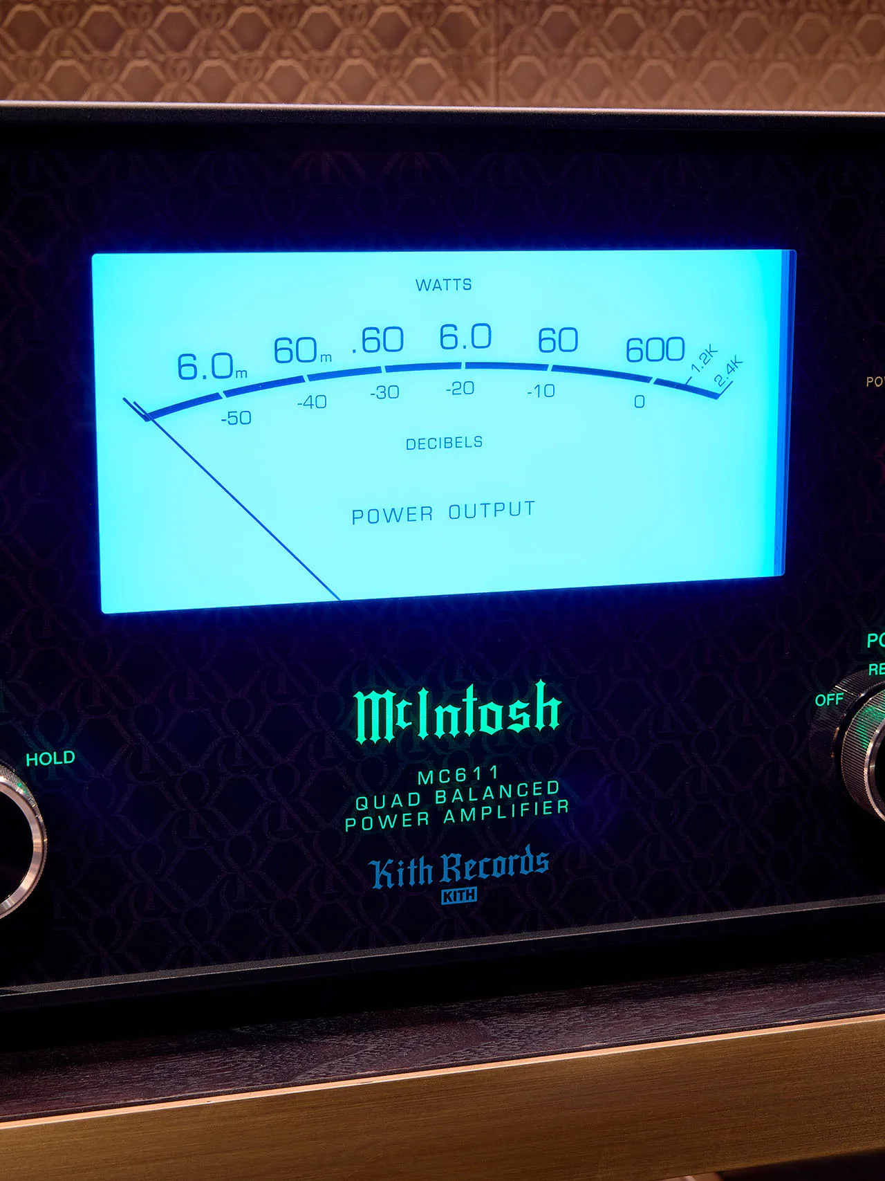 A McIntosh meter glowing blue, close up.